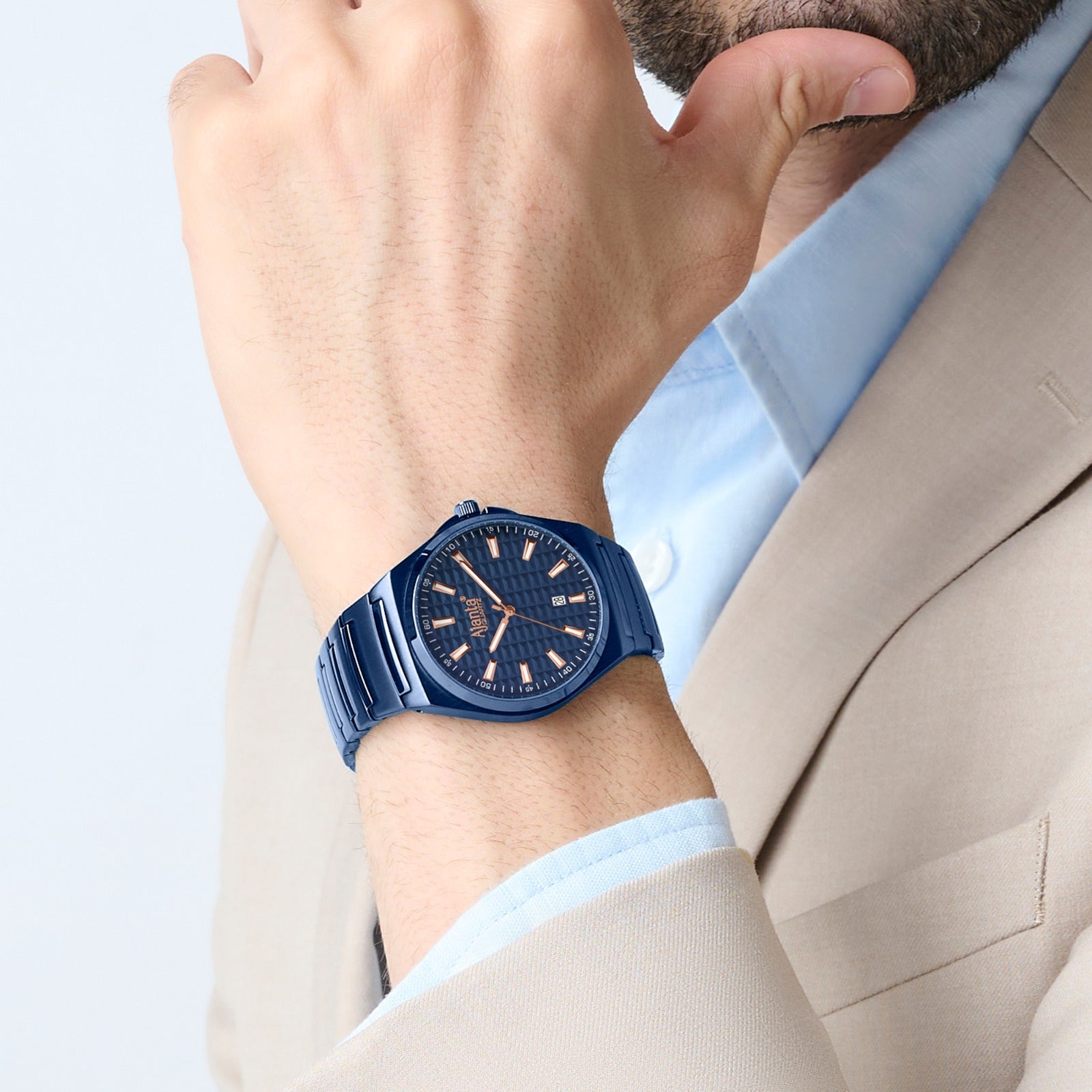 Person wearing a blue watch on a light background